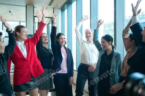 Preview: Business professionals stacking hands together to show teamwork