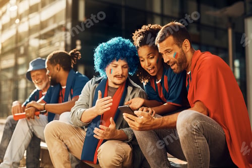 Preview: Group of sports fans watching soccer match via live stream on cell phone.