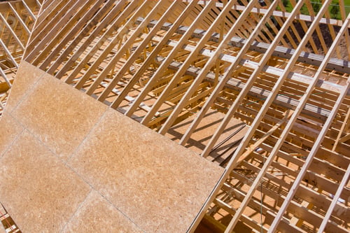 Preview: Wooden roofing truss frame installation under construction of a house roof