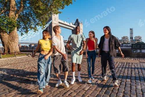 Preview: Multiracial group of happy young friends bonding in London