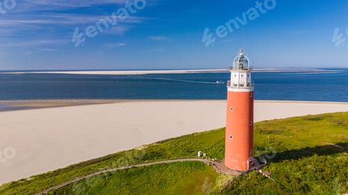 Preview: Texel Lighthouse, A unique perspective from beneath the sea level looking up at a lighthouse