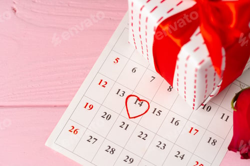 Preview: Valentines day gift and rose on wooden table