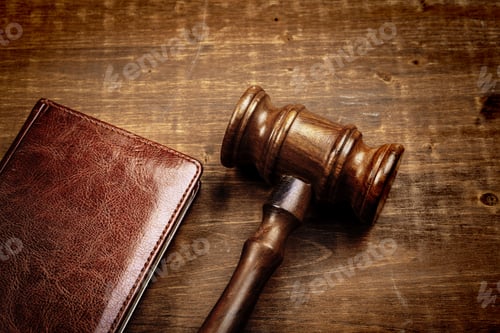 Preview: Image of wooden judge hammer on notepad