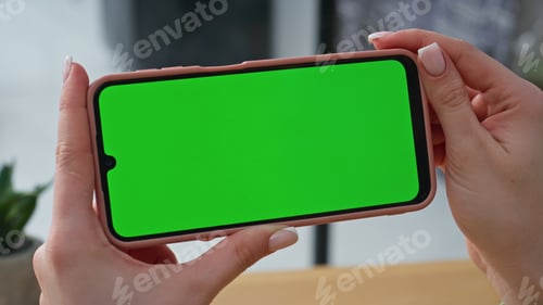 Preview: Company professional holding chroma key horizontal cellphone at office closeup