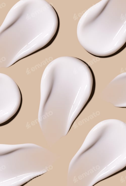 Preview: textures pattern of cream smears close-up on beige background