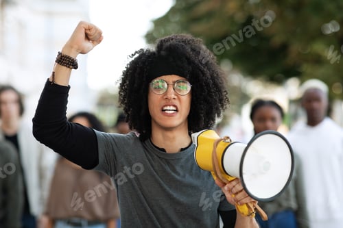Preview: Guy with megaphone leading group of protestors