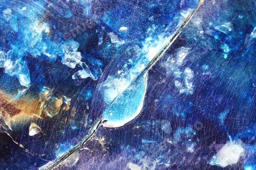 Preview: Abstract glass texture. Cracks on a piece of blue glass