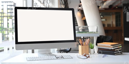 Preview: Photo of white blank screen computer monitor on office desk.