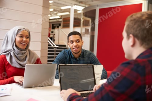 Preview: Group Of University Students Collaborating On Project