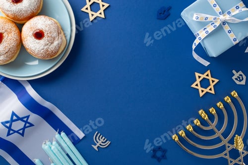 Preview: Engage in Hanukkah customs with a top-view shot showcasing sufganiyot, Star of David symbols