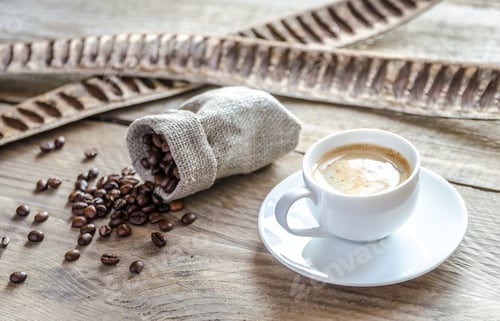 Preview: Cup of coffee with coffee beans