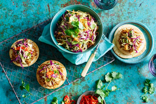 Preview: Vibrant taco meal on a rustic blue table