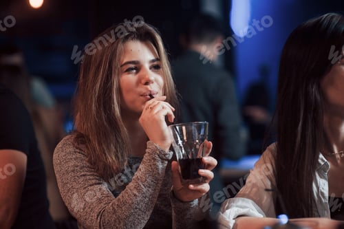 Preview: Drinking alcohol. Happy people have conversation in the luxury night club together