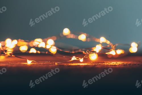 Preview: Illuminated garland close up on dark background