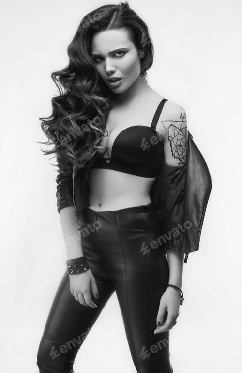 Preview: Portrait Of Young Sexy Girl With Long Hair In Leather Jacket Isolated On White Background In Studio