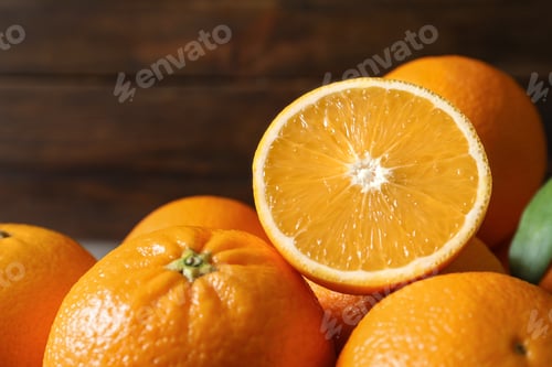 Preview: Fresh oranges on blurred background, closeup. Healthy fruits