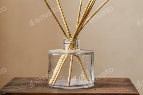 Preview: Closeup of scented candles on a wooden stand