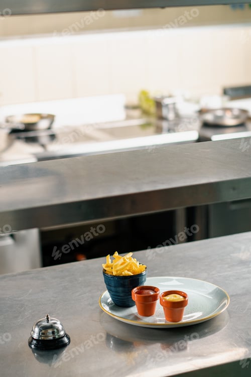 Preview: Professional kitchen in the hotel restaurant french fries and sauces on plate