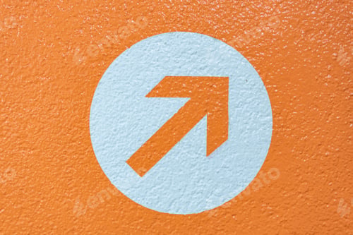Preview: Closeup shot of a painted arrow on the orange background