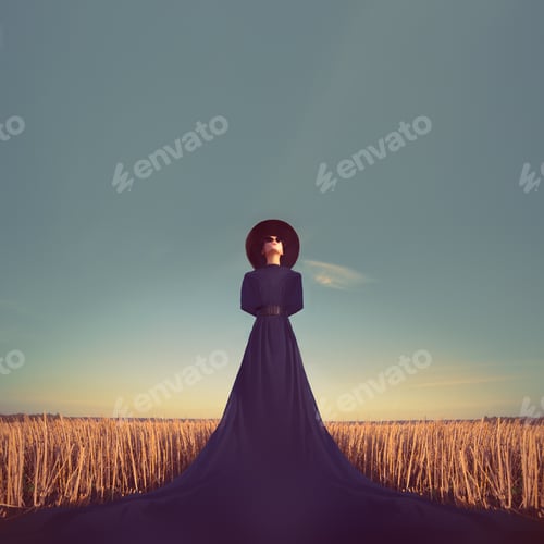 Preview: Sensual portrait of a girl in a black dress in the forest