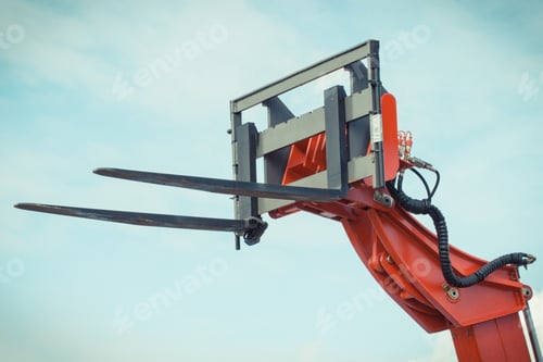 Preview: Part of forklift loader or stacker on sky background. Technology in transport