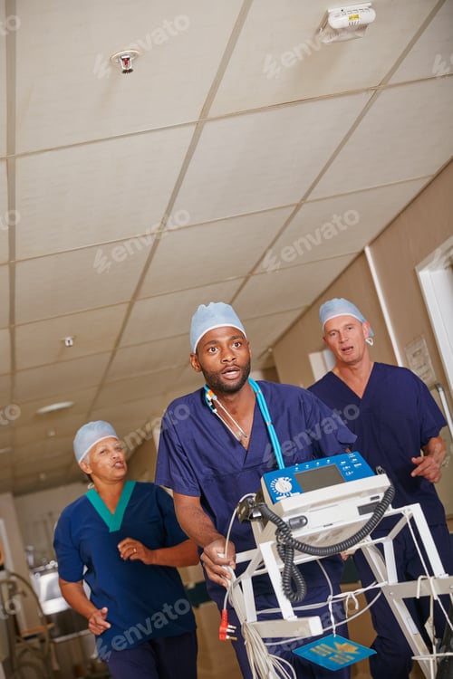 Preview: Its an emergency. Shot of a medical team rushing through a hospital corridor.