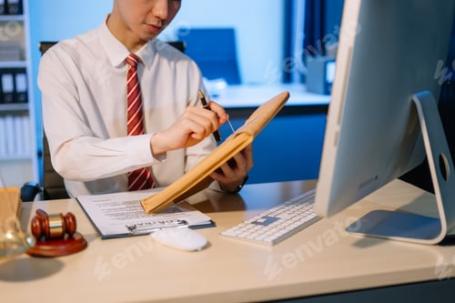 Preview: Young Man Working in Legal Office at Night