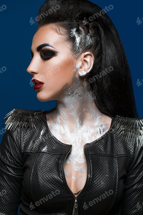 Preview: Girl With Creative Make-Up On A Blue Background