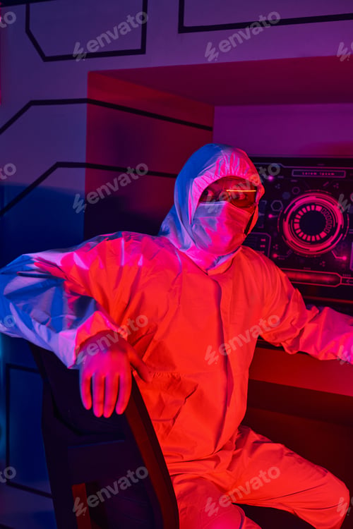 Preview: space exploration, indian scientist in hazmat suit looking away in futuristic innovation hub