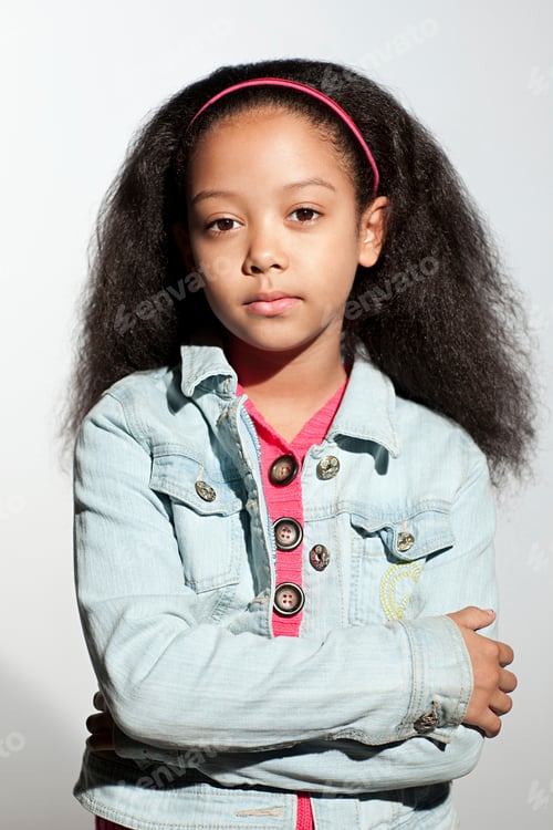 Preview: Girl in denim jacket with arms crossed