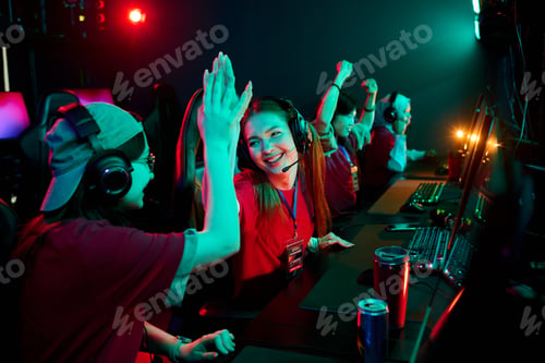 Preview: Teenage Caucasian Girls E-sports Team Celebrating Victory While Gaming Together
