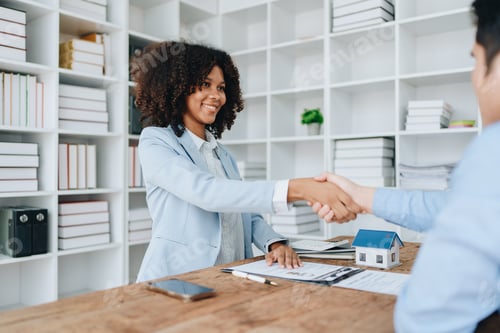 Preview: The bank's Female African american Mortgage Officers shake hands