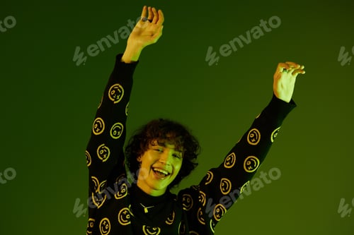 Preview: Man fashion and style accessories model with curly hair stylish sweater, hipster dance smile hands