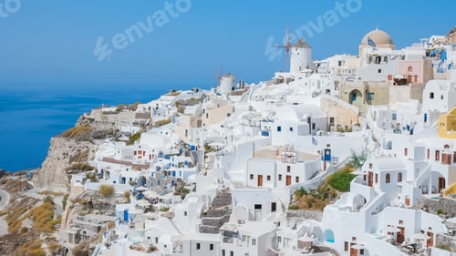 Preview: Oia Santorini Greece on a sunny day during summer with whitewashed homes and churches, Greek Island