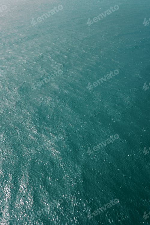 Preview: Blue sea sparkling in the sun. Top view