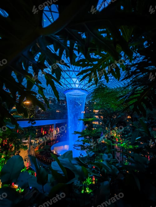 Preview: View of the magnificent HSBC Rain Vortex at Jewel Changi Airport at night.