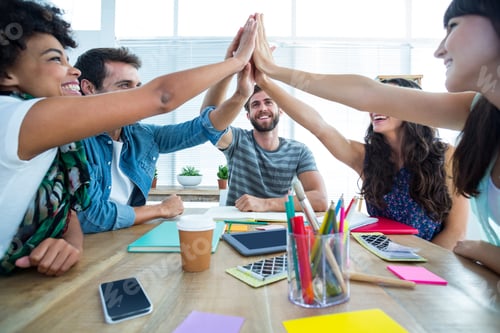 Preview: Creative Business Team Putting Hands Together At The Office