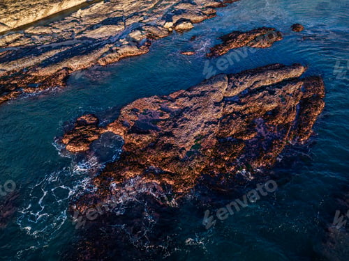 Preview: Rocky Shoreline and Blue Ocean Waters of Vancouver Island at Sunset