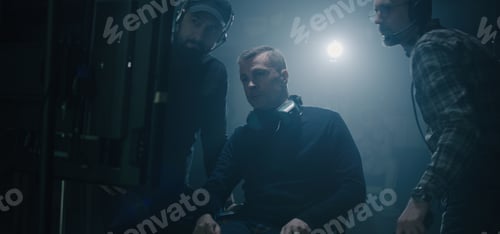 Preview: Medium Shot Of A Director Sitting Down Into His Chair And Starting Giving Instructions