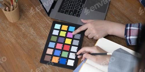Preview: designer graphic creative creativity working together coloring using graphics tablet and a stylus at