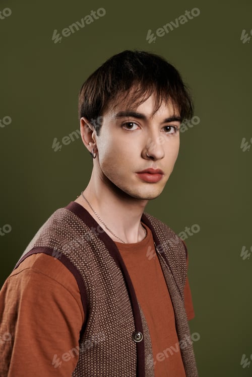 Preview: A Study in Olive: An Elegant Man Poses Against a Vibrant Background