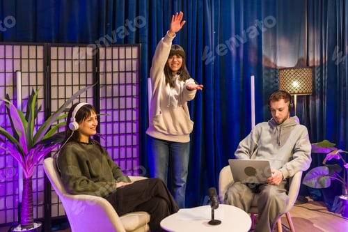 Preview: Young adults creating social media content in a podcasting studio