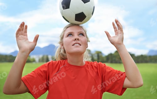 Preview: Its all about balance. Shot of a young female soccer player balancing a ball on her head.