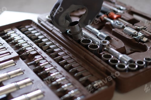 Preview: a professional worker taking the instrument tool from the toolbox set