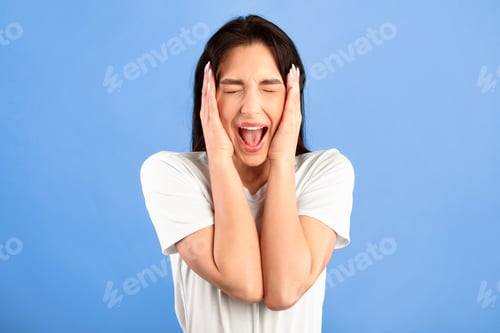 Preview: Close up portrait of screaming young lady