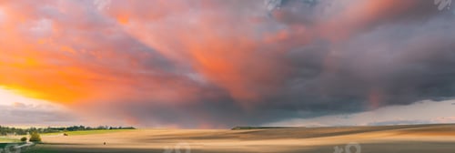 Preview: Field At Sunset Sunrise. Morning Sunrise Evening Sunset Sky Above Countryside Meadow Landscape