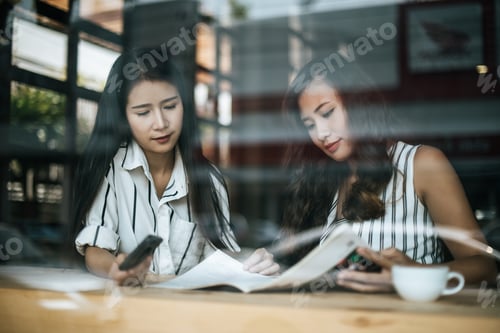 Preview: Two beautiful women talking everything together at coffee shop cafe