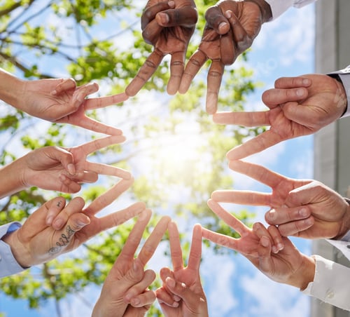 Preview: Shot of a group of unrecognizable businesspeople making a star shape with their hands
