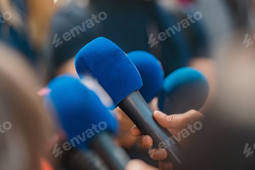 Preview: News reporters interviewing a politician.