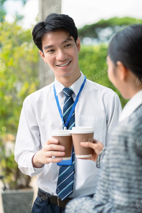 Preview: Happy creative people descent holds a cup of coffee and talking discussion ideas and happily.